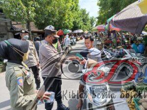Sosialisasikan Prokes Covid-19, Polres Ngawi Gelar Ops Yustisi di Pasar Besar