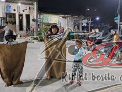 Serunya Lomba Balap Karung Pakai Helm, Sambut HUT RI ke-77